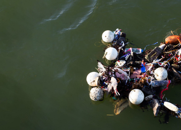 Plastic debris and trash snarled up in a fishing net.