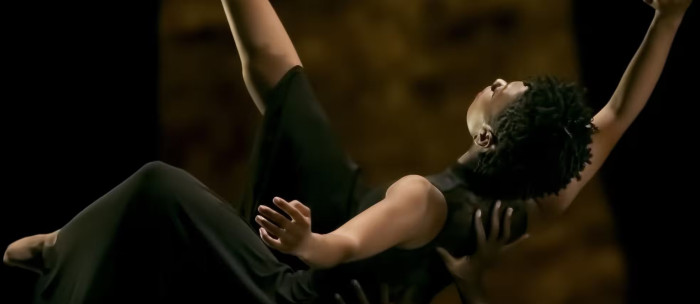 A person being held in the horizontal. 