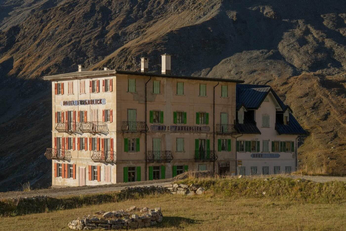 A multi-story building in the high mountains. 