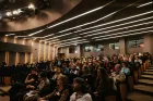 A theatre filled with people.