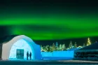 An ice building with northern lights. 