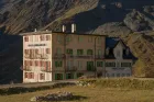 A multi-story building in the high mountains. 