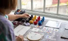 View from behind of a person painting. 