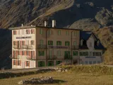A multi-story building in the high mountains. 