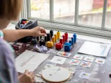 View from behind of a person painting. 