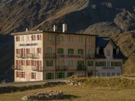 A multi-story building in the high mountains. 